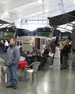 Washington State Evergreen Spring RV Show: Visitors explore the indoor motorhome exhibits in comfort and warmth